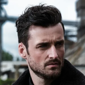 Confident man with full dark curly hair showcasing Hairskeen Comfort Thin Skeen hair system